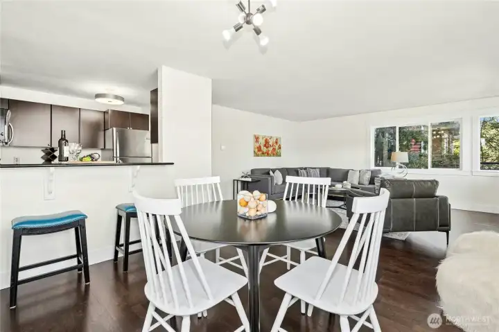 Another view of the open layout, showcasing the flow between living, dining, and kitchen spaces.