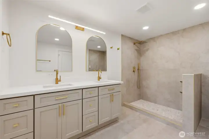 Primary bathroom! With a beautiful tiled out shower and custom made vanity.