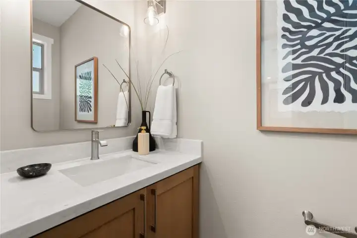 Powder room/half bath is gorgeous and located just inside the front door, adjoining the great room Powder room/half bath is gorgeous and located just inside the front door, adjoining the great room
