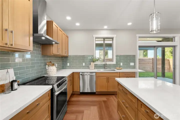 This chef's kitchen is amazing! You'll love cooking here and dining al fresco on the rear patio This chef's kitchen is amazing! You'll love cooking here and dining al fresco on the rear patio