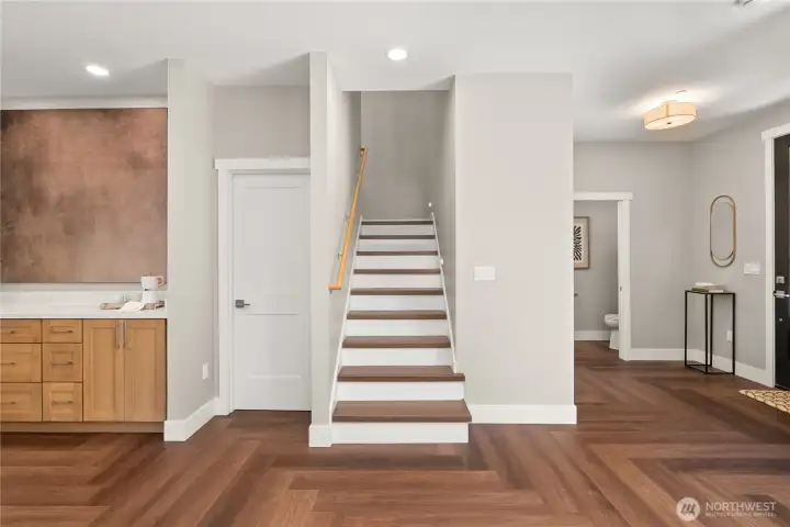 This way to the second floor! And here's a bonus: the builder made smart use of the space under the stairs for added convenient storage! This way to the second floor! And here's a bonus: the builder made smart use of the space under the stairs for added convenient storage!