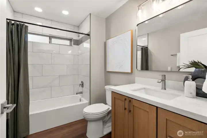 Hall full bath with tub is located between primary bedroom and bedrooms 2 and 3 Hall full bath with tub is located between primary bedroom and bedrooms 2 and 3