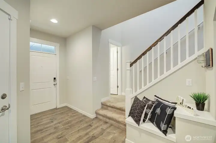 A welcoming entry introduces the home's clean, modern interior.