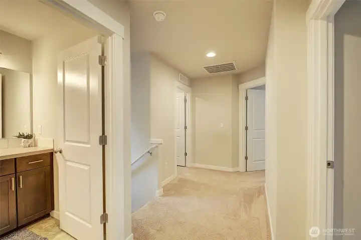 Well proportioned upstairs hall to easily navigate to rooms.