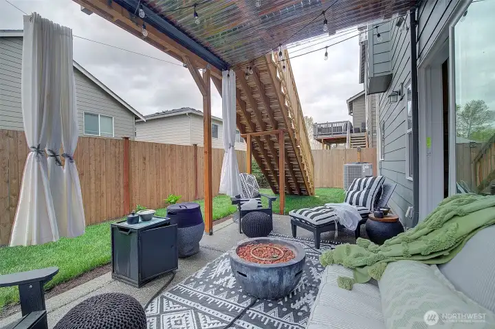 A second outdoor living area offers flexibility for relaxing and entertaining,