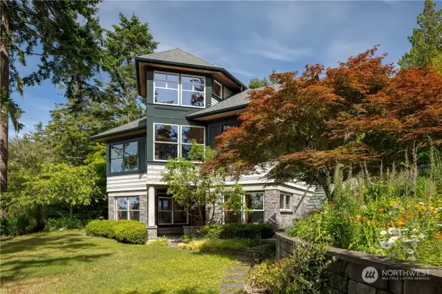 Mature gardens surround this home on 582 feet of waterfront.