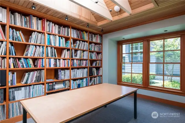 This skylit studio/office has built-in fir bookshelves.  Pictured is the south part of the main room.
