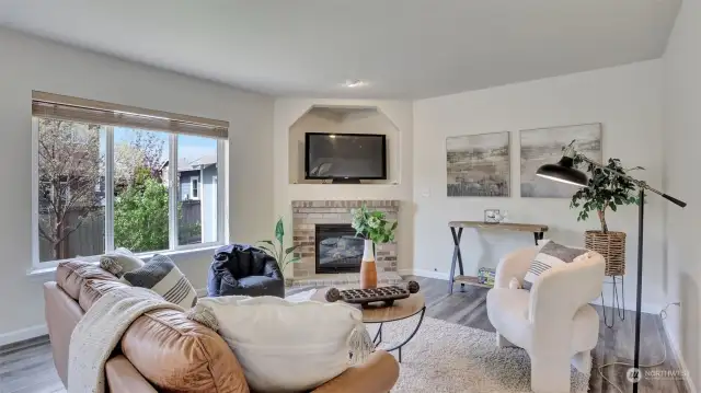 Cozy up in this den with gas fireplace and views of the back yard.