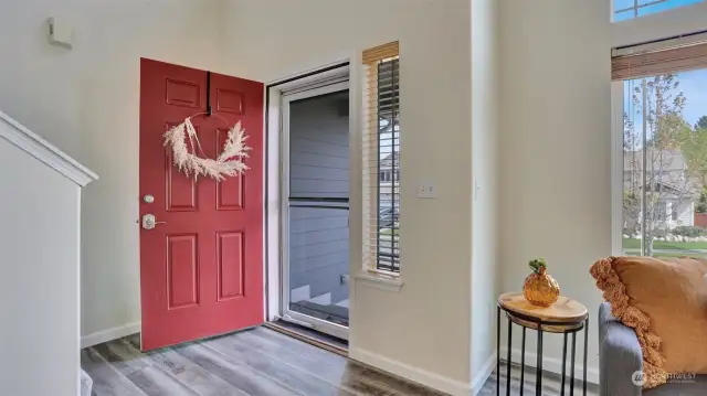 Spacious entryway with soaring ceilings & loads of natural light welcomes you home.