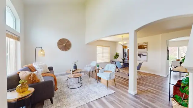 Soaring vaulted ceilings, wall of windows & fresh interior paint really open this space!