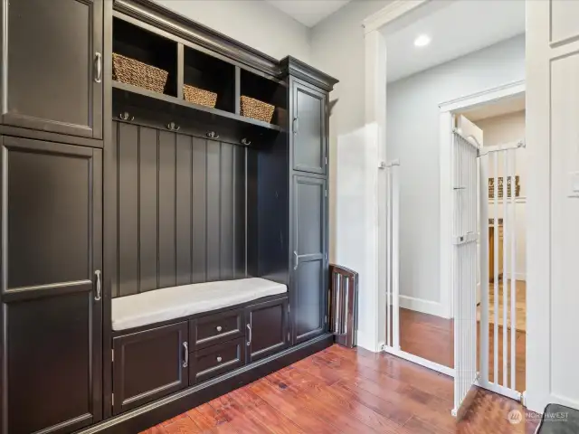 The mud room is conveniently located across the hall from the laundry room.