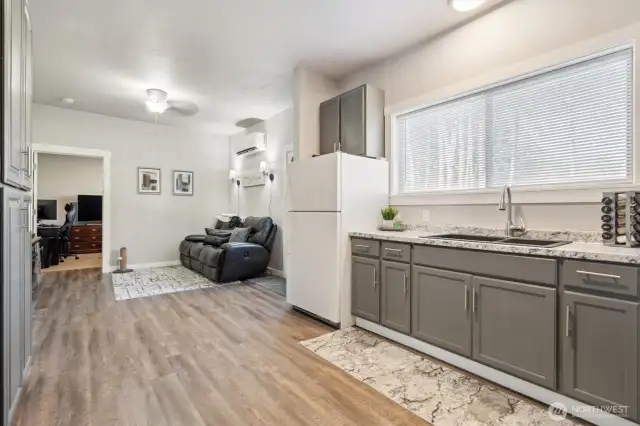 This 464 SF finished space is conveniently located in the detached shop; featuring a private entrance, kitchenette, bathroom and sitting area.