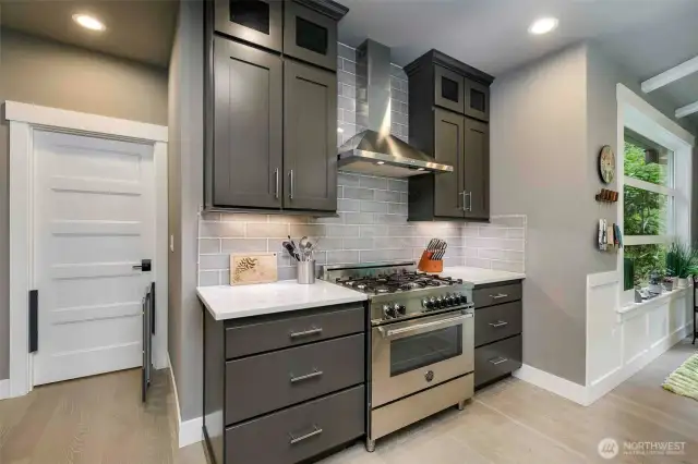 Kitchen features gas range.