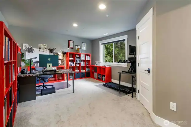 Spacious bedroom currently used as an office.