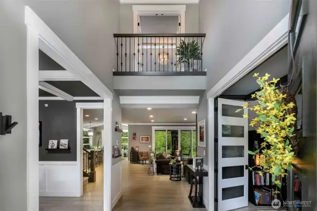 Grand foyer opens to living room, dining room and study.