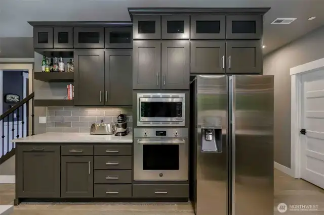 Kitchen features plety of counter and storage space including walk-in pantry.
