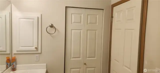 Shows Primary bath with double sinks, medicine cabinet and Lennon closet