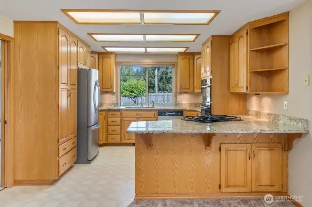 The cabinet on the left is a pantry with lots of pull out storage space.