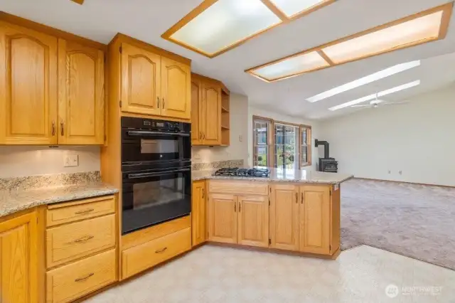 Granite counters, oven/microwave combination and gas cooktop.