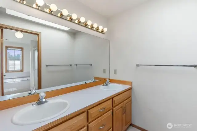 Primary bedroom dual vanity.