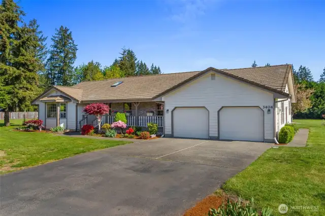 Relax on the Country Porch! Tile roof recently maintained. Cement plank siding all the way around. Bigger 2 car attached garage, plus a 2 bay shop out back!
