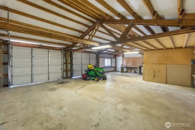 Shop is spacious and clean. The riding lawn mower can be included in the purchase at no value.