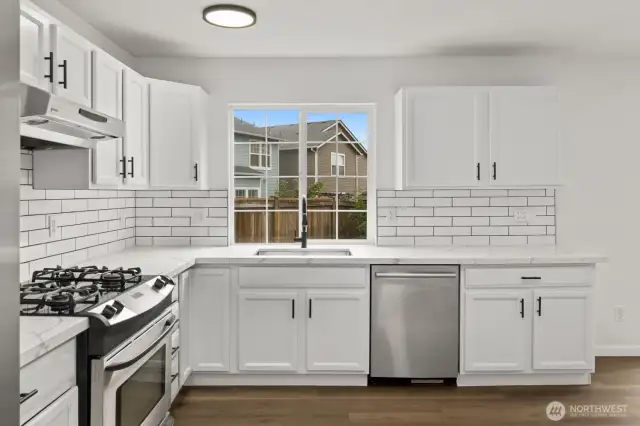 Enjoy the view of your fully fenced backyard from the kitchen window.