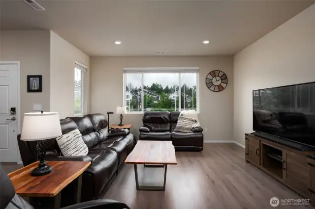 Livingroom overlooks the front yard and community play area
