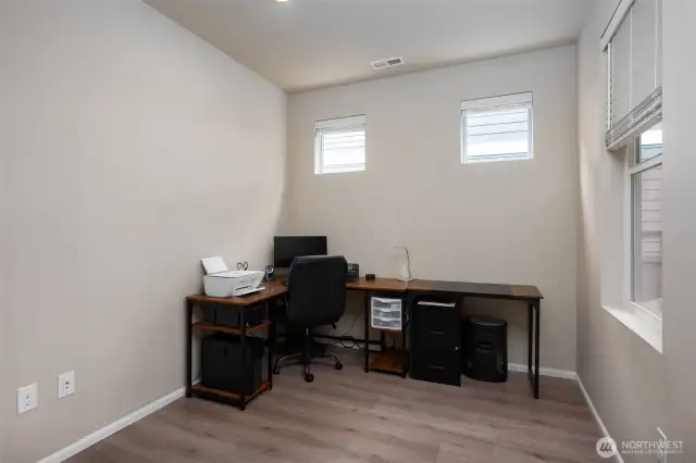 Floorplan features flex space for office or den.