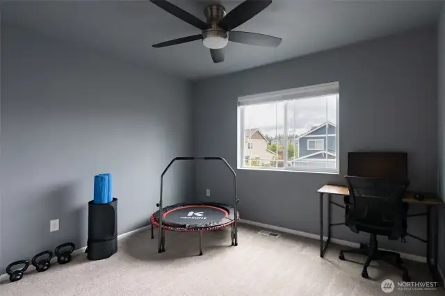 Large 3rd bedroom with ceiling fan.