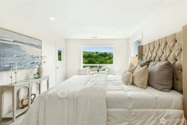 Take your morning coffee or a good book onto the covered balcony off the primary suite for a calm morning with a great view.