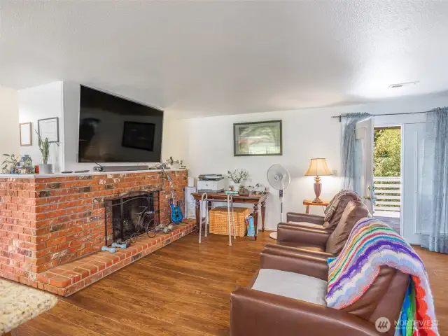 Living room with wood burning fireplace