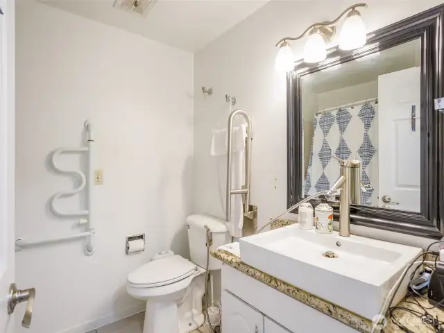 One main floor bathroom, with walk in shower/tub