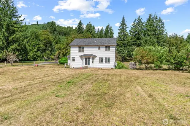 Back of home with amazing level 2 +/- acres!