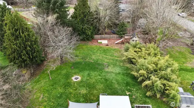 Back yard is huge with playhouse