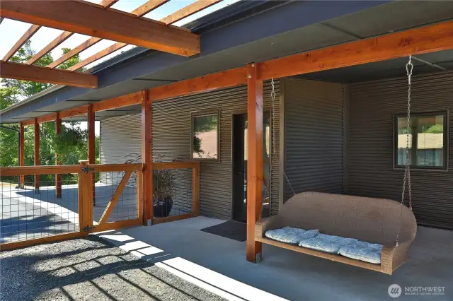 Outdoor fenced area with carport & driveway
