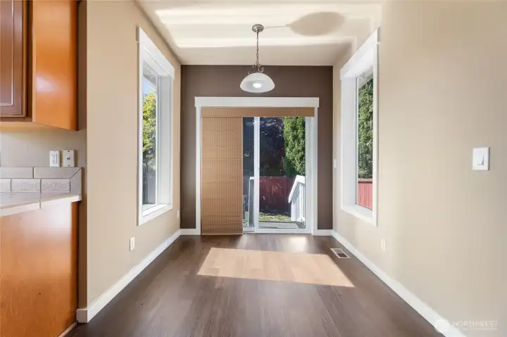 Kitchen nook with glass sliding door to access the backyard & patio.