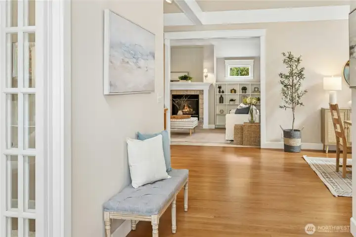 The spacious entryway opens up to the light-filled communal hub in the center of the home, complete with hardwood floors.