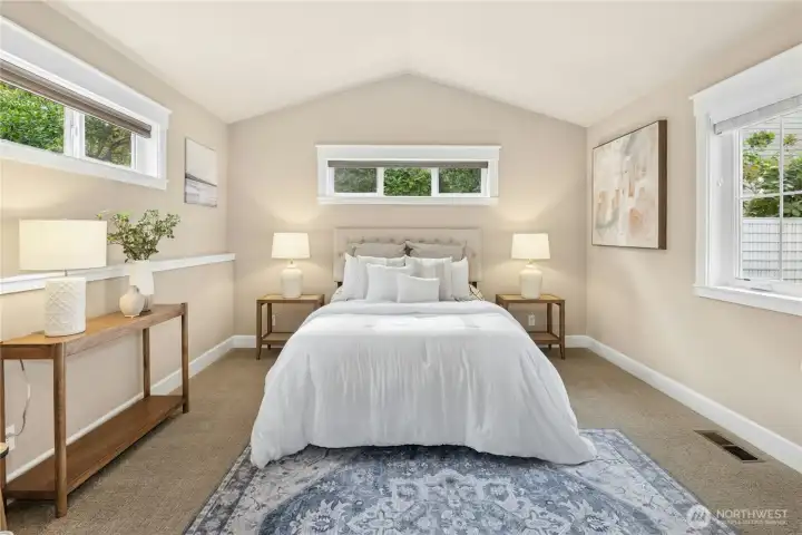 The private primary suite features a spacious walkthrough closet and ensuite bathroom.