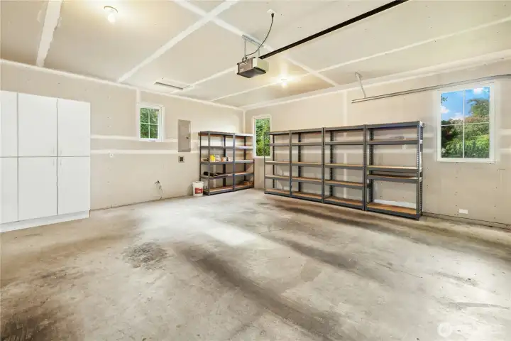 The two-car garage has plenty of room for storage, gear, and electric bikes.