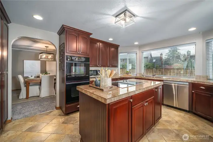 From the dining room, step into this incredible chef’s kitchen where cabinetry and counter space abound.