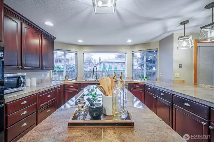 Enjoy the center island for prep work, with large picture windows filling the space with natural light.