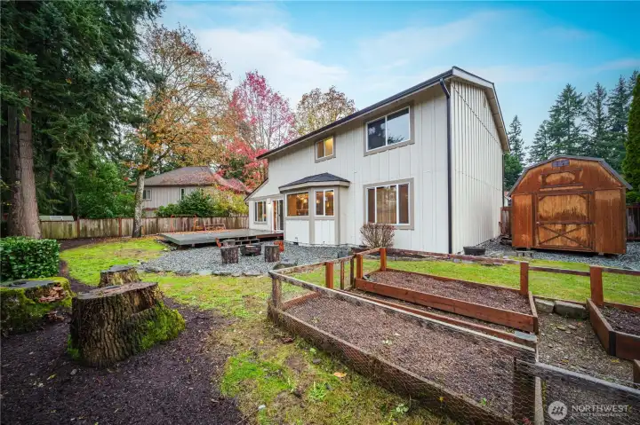 A large side-yard shed is ideal for garden tools, and a firepit area invites summertime s’mores.