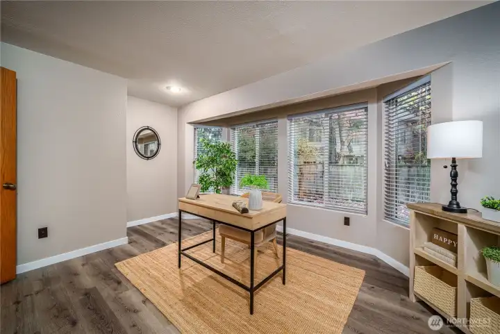 Down the hall from the family room is a versatile office/den—great for work, workouts, or crafting.