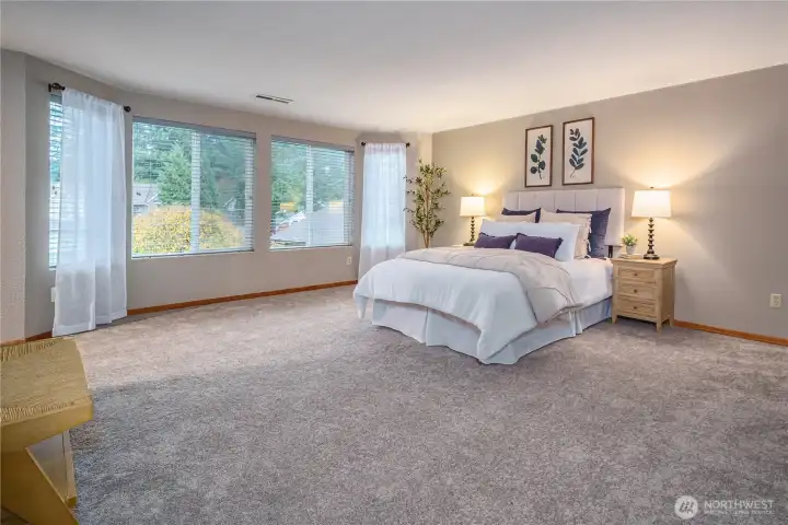 The primary bedroom is a true retreat—an oasis for relaxing and unwinding.