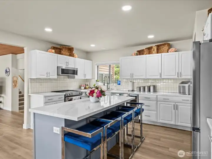 Entering the Refrigerator While Guest sits at the Island Provides Ample Maneuverability.