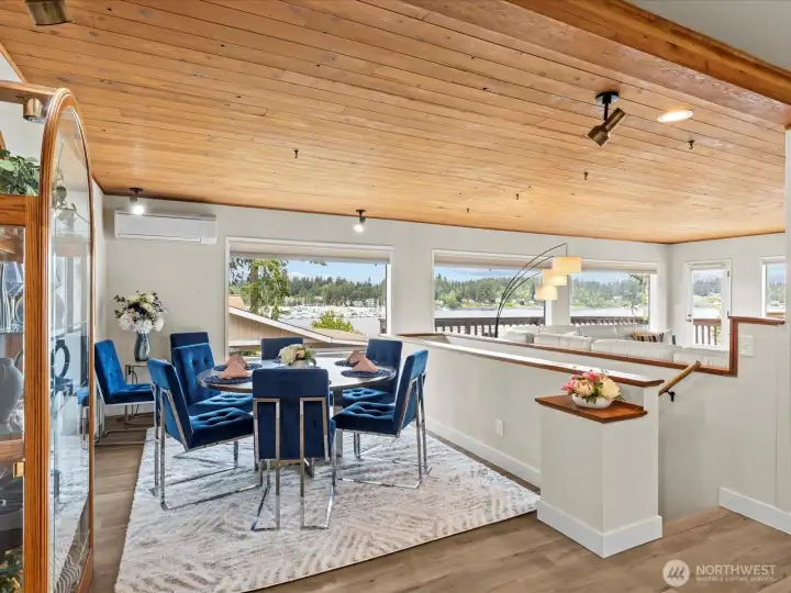 Adjacent from the Kitchen and Island Eating Space You Step into the Formal Dining Area, all while Soaking in the Lovely Water Views.