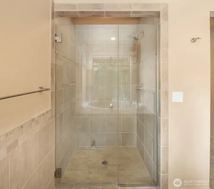 Shower in primary, across from the tub.