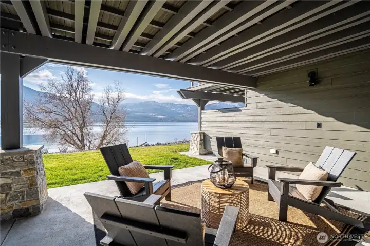 Spacious covered patio outside the living room lets you enjoy the outdoors any time of year. Pre-wired for ceiling patio heaters and pre-wired for your private hot tub addition.