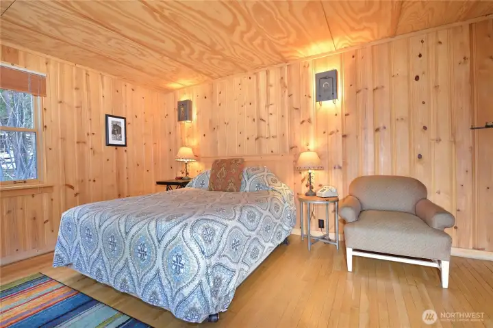 Comfortable queen bed with reading chair